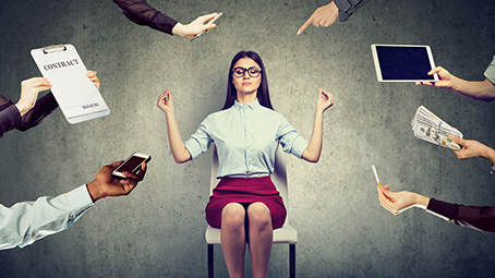 Woman trying to meditate while people are bothering her